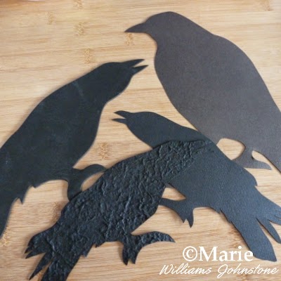 Bird motifs cut from black paper and card