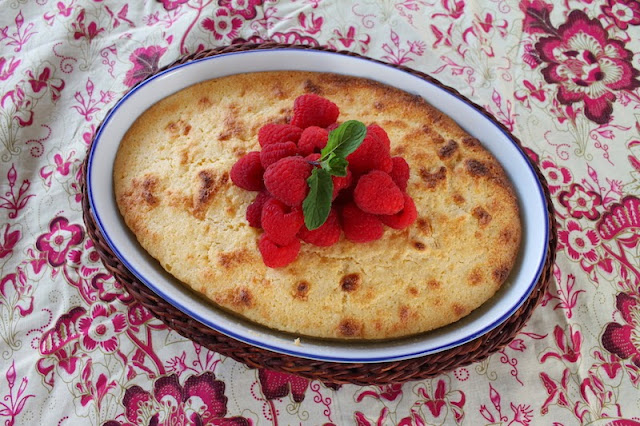 Food Lust People Love: Fresh lemon zest and lemon juice are the stars of this tart, sweet baked lemon dessert spooned into a buttered casserole dish and baked until light and fluffy. The supporting role is played by the raspberries or whatever berry you can get your hands on this time of year.