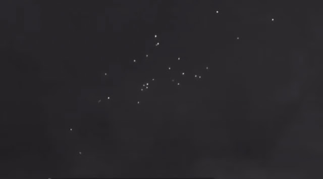 Large fleet formation of UFOs slowing down and speeding up plus turning.