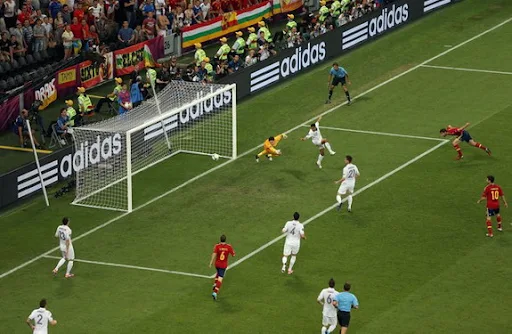 Spain midfielder Xabi Alonso heads in the opening goal past France goalkeeper Hugo Lloris