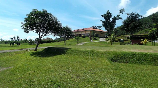 view of clubhouse from the greens at san juanico park golf and country club