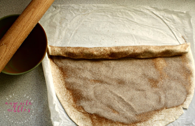 Rolling sugar onto gluten-free puff pastry for palmiers