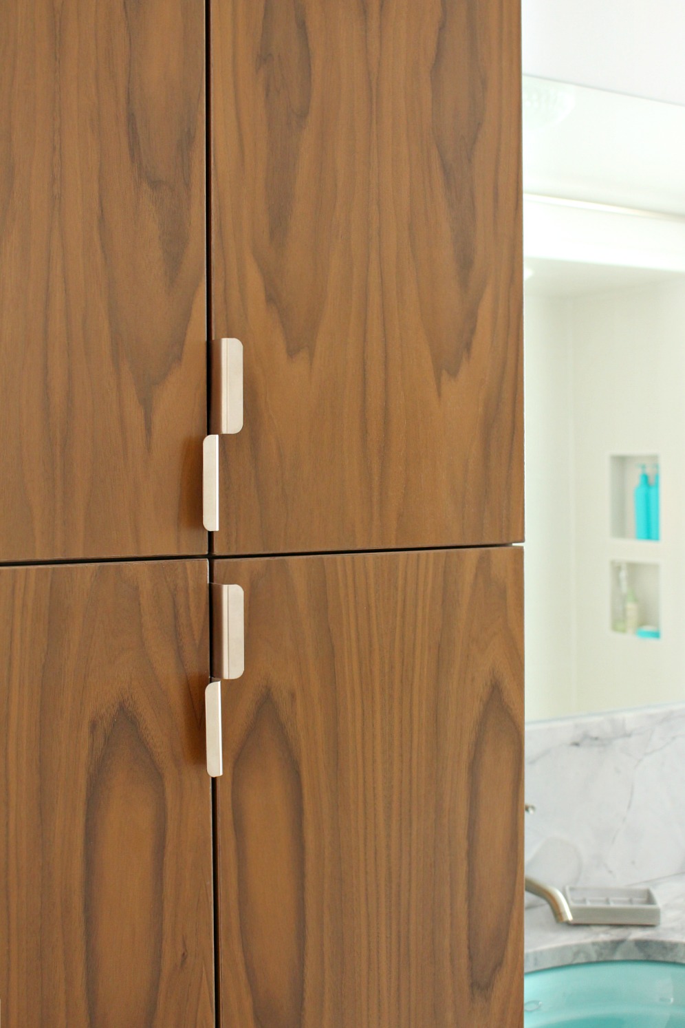 Bathroom Reno Update: Mid-Century Modern Inspired Cabinet Pulls ... - Vertical pulls on tall cabinet doors