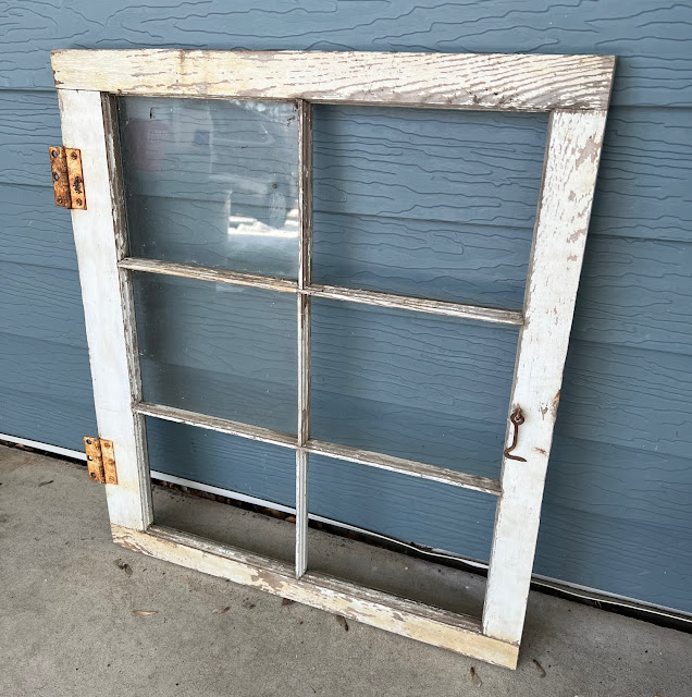 Photo of a chippy window frame.
