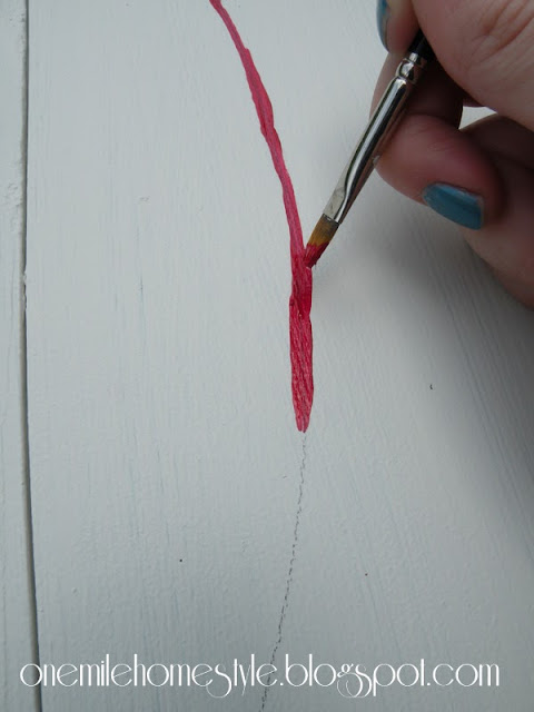 Painting the baseball seams on the table