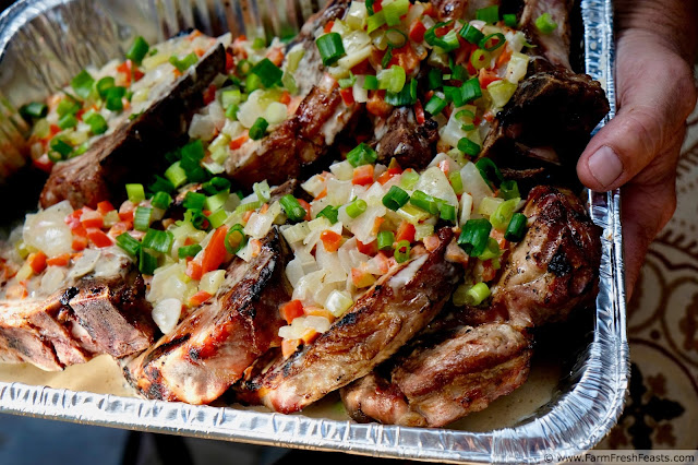 close up image of a tray of creole style smothered pork chops