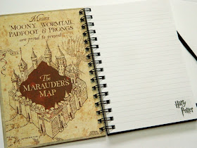 The inside of a Harry Potter notebook featuring the Marauder's map from the books and movies