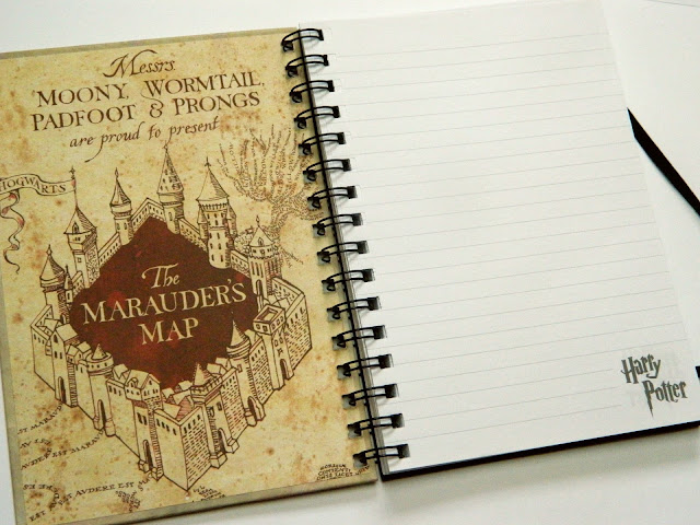 The inside of a Harry Potter notebook featuring the Marauder's map from the books and movies