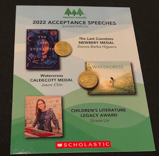 a post card from the 2022 awards dinner showing the winners of the Newbery Medal, the Caldecott Medal, and the Children's Literature Legacy Award