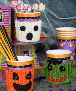 http://www.redheart.com/free-patterns/spooky-cup-cozies