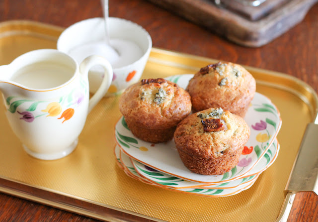 Food Lust People Love: Not quite savory and not quite sweet, these fig and Stilton muffins are the perfect marriage of fruit and cheese in a fluffy quick bread. Serve for breakfast, tea time or as an accompaniment to a light lunch. If you don’t have access to Stilton, substitute your favorite strong flavored blue cheese that crumbles well. The sweet sticky figs are the perfect complement to a strong blue cheese.