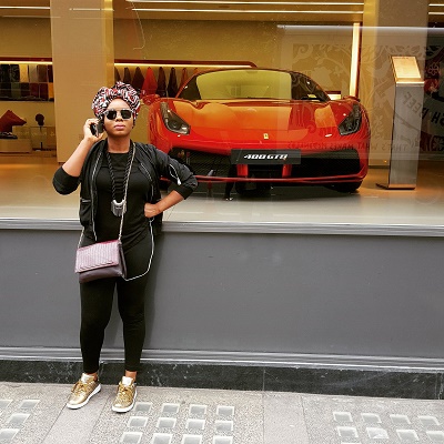 Photo: Yemi Alalde poses in Ferrari Shop 