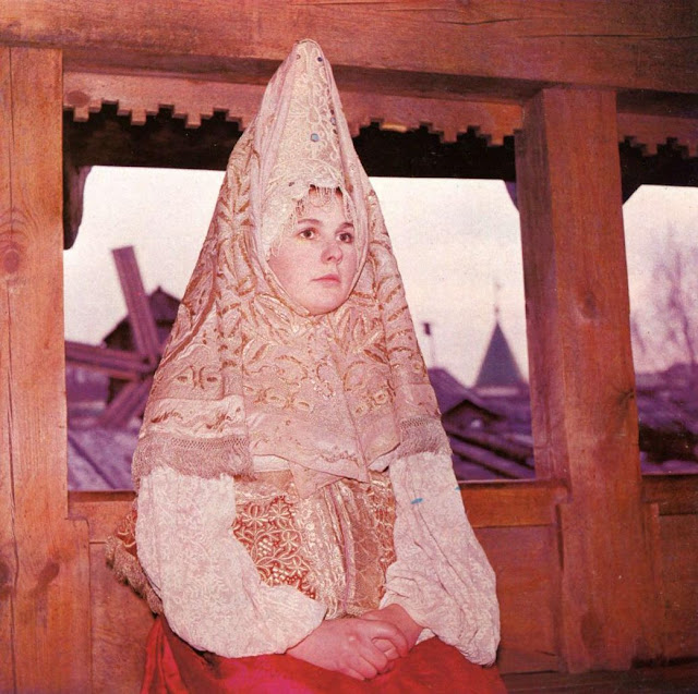 Woman dressed in traditional Russian costume with kokoshnik
