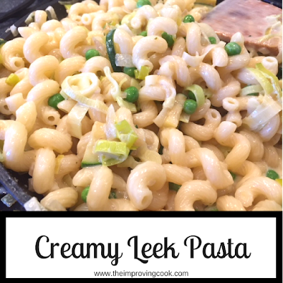 creamy leek pasta in a pan with text overlay