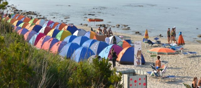 Tents of young people at Rodon Cape beach