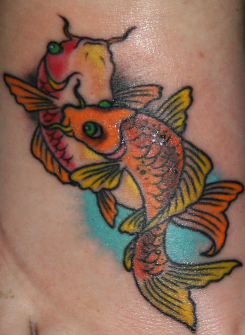 Tattoo of two koi fish