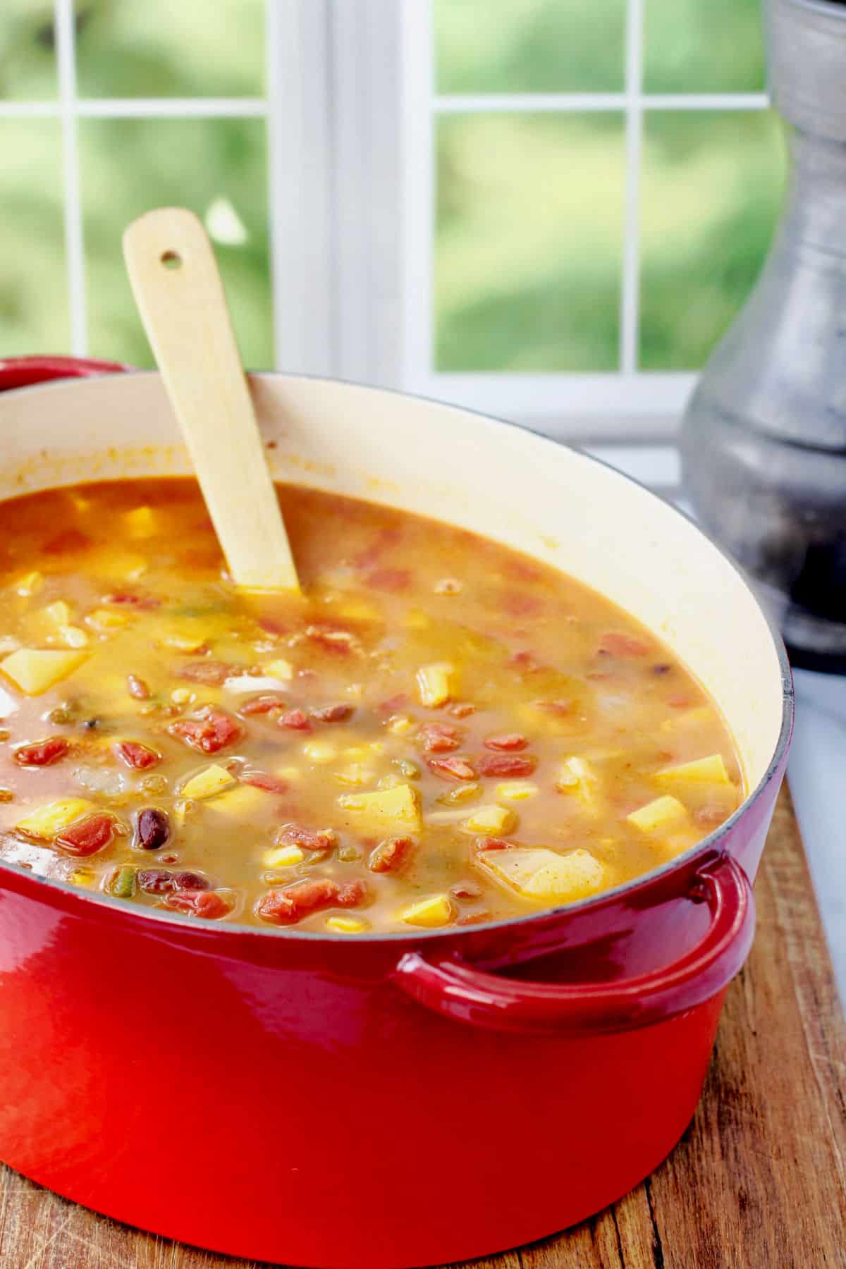 Three Sisters Soup in a red oval Dutch oven.