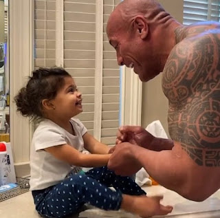 Curtis Bowles' step-sibling The Rock with his daughter