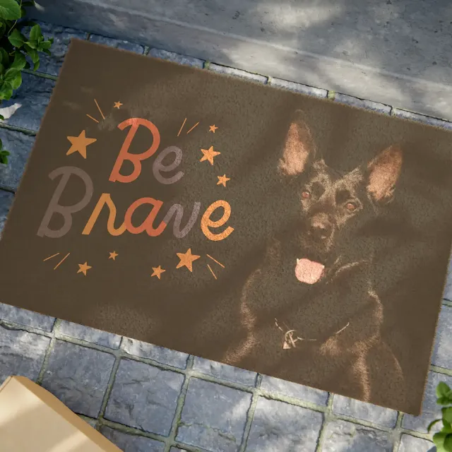 Doormat With A Solid Jet Black Working Line German Shepherd and caption Be Brave