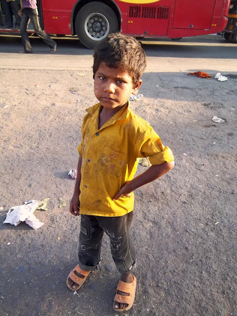 poor young boy on Indian street