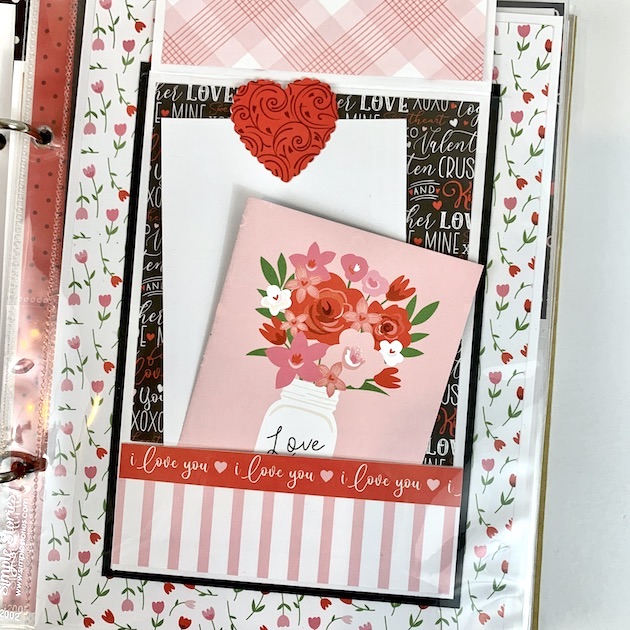 Love You More Scrapbook page with flowers, a pocket and journaling cards