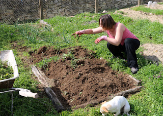 A getting her hands dirty in the garden