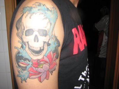 skull tattoo arm. skull and flower tattoo, arm
