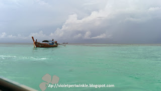 emerald sea blue sky boat