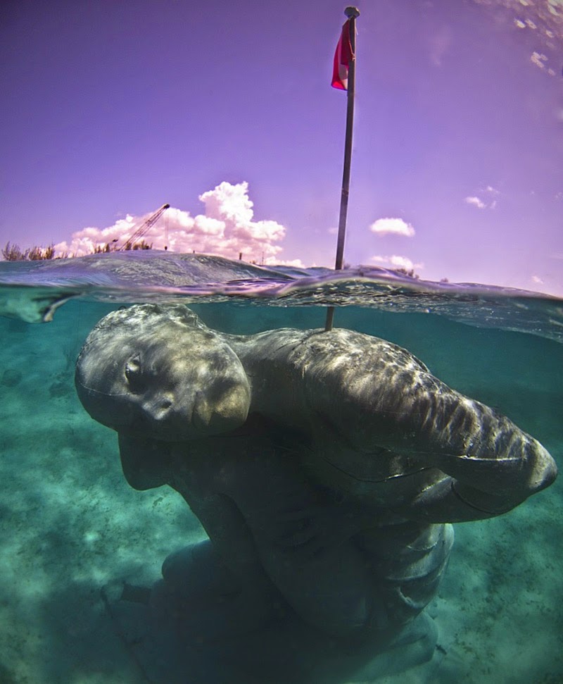 Ocean Atlas: A Massive Submerged Girl Carries the Weight of the Ocean