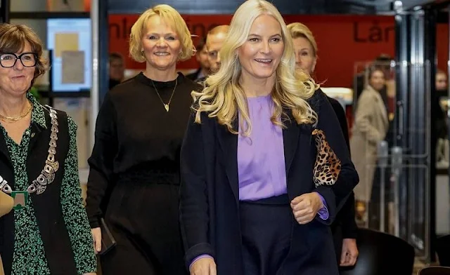 Crown Princess Mette-Marit wore a new Banora light purple, lavender, silk blouse by Hugo Boss