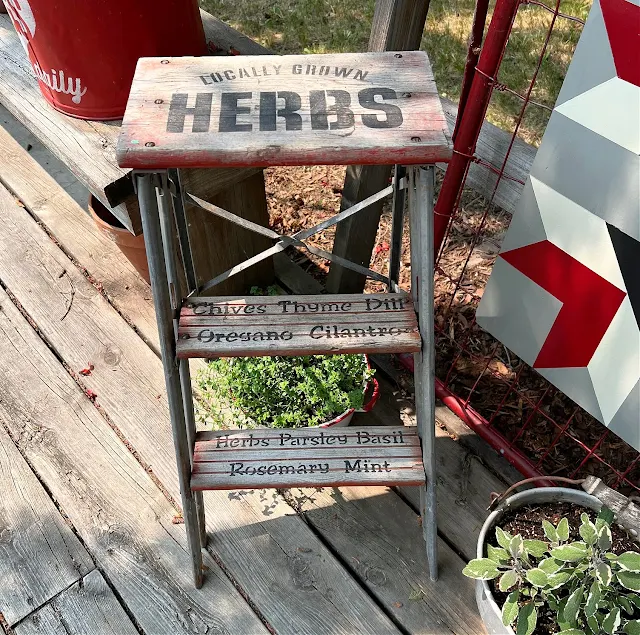 Photo of a rustic step stool stenciled with herb stencils.