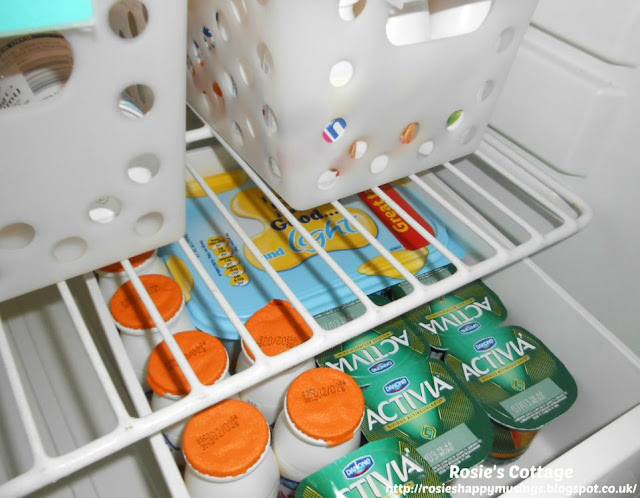 Refrigerator organization using bins - extra yogurts, health drinks & dairy spread make up our "extras" bin.