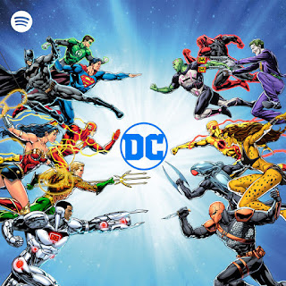 Various DC comic characters like Batman, Superman, Wonderwoman etc around the DC logo with the spotify logo in the corner