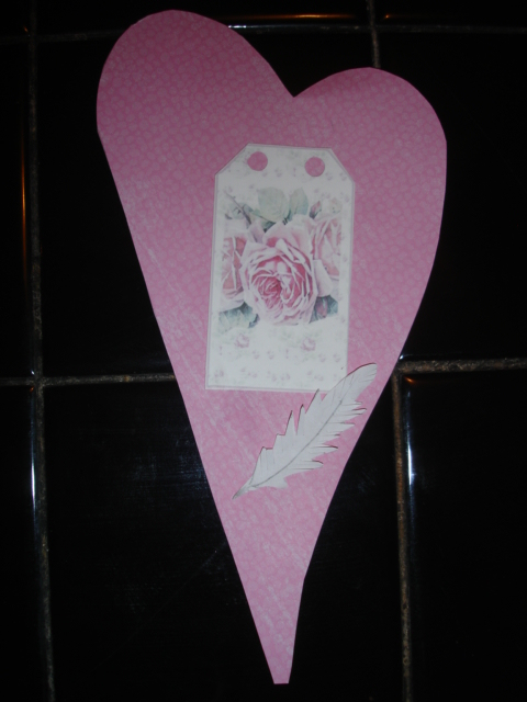 This is done with a clipart tag and a hand made feather which can be made 