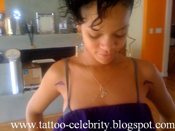 rihanna tattoos and meanings. rihanna tattoos and meanings.