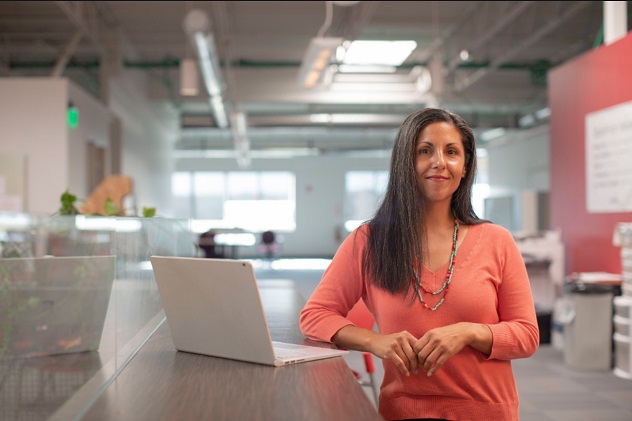 A woman representative is doing an introduction to her medical device company