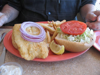 Click to enlarge - White fish, breaded and fried in a sandwich.