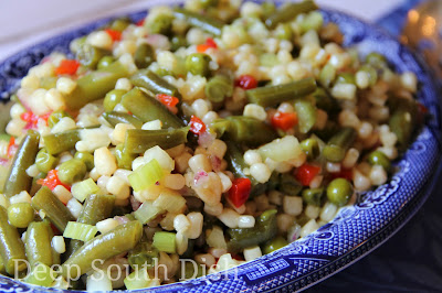 A classic vegetable salad of corn, green beans, and peas, marinated in a sweet and sour vinegar and sugar dressing.