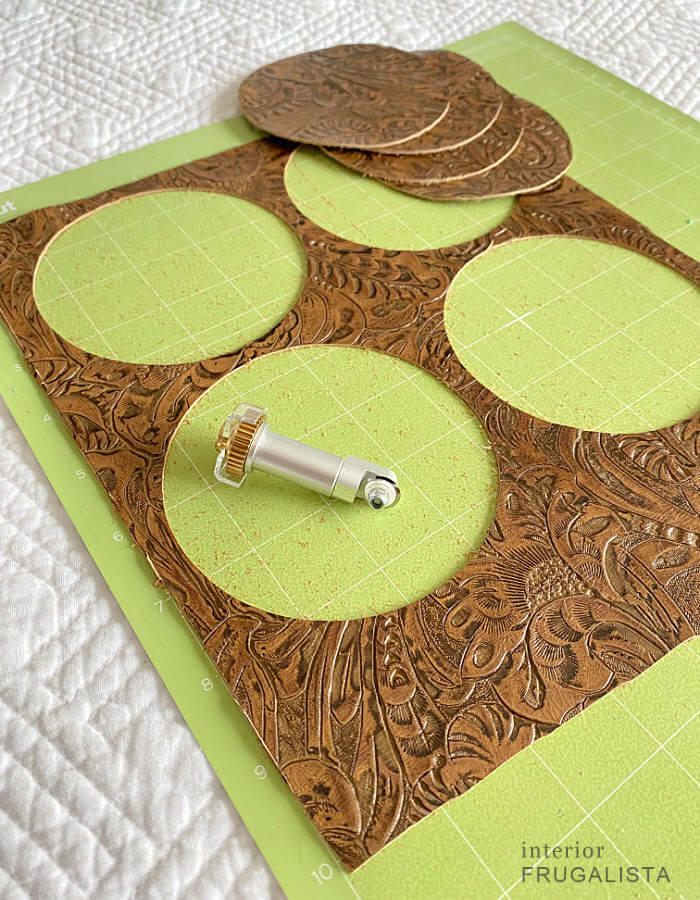 Cutting embossed leather coasters with a Cricut Maker machine.