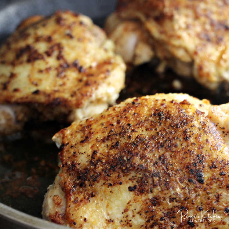 Process photo of chicken thighs for oven bbq chicken thighs recipe browned in skillet