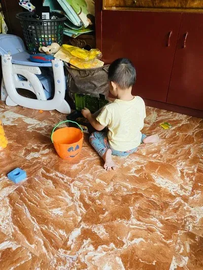 Little boy playing with his toys