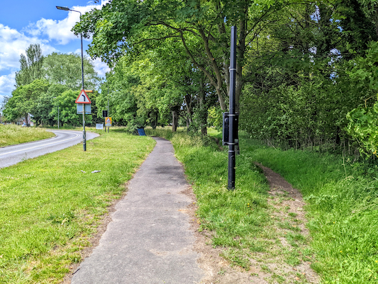 Take the track just to the right of the black post