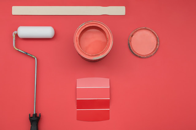 painting supplies on pink wall, unsplash.com