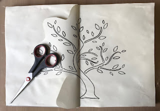 image tree outline in art journal with scissors 