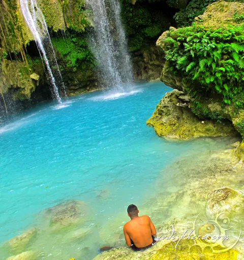 hover_share Solitary man watching and admiring the beauty of Mag-aso falls 