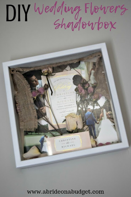 Preserve your wedding items with a beautiful DIY Wedding Flowers Shadowbox. Get the tutorial to make one on www.abrideonabudget.com.