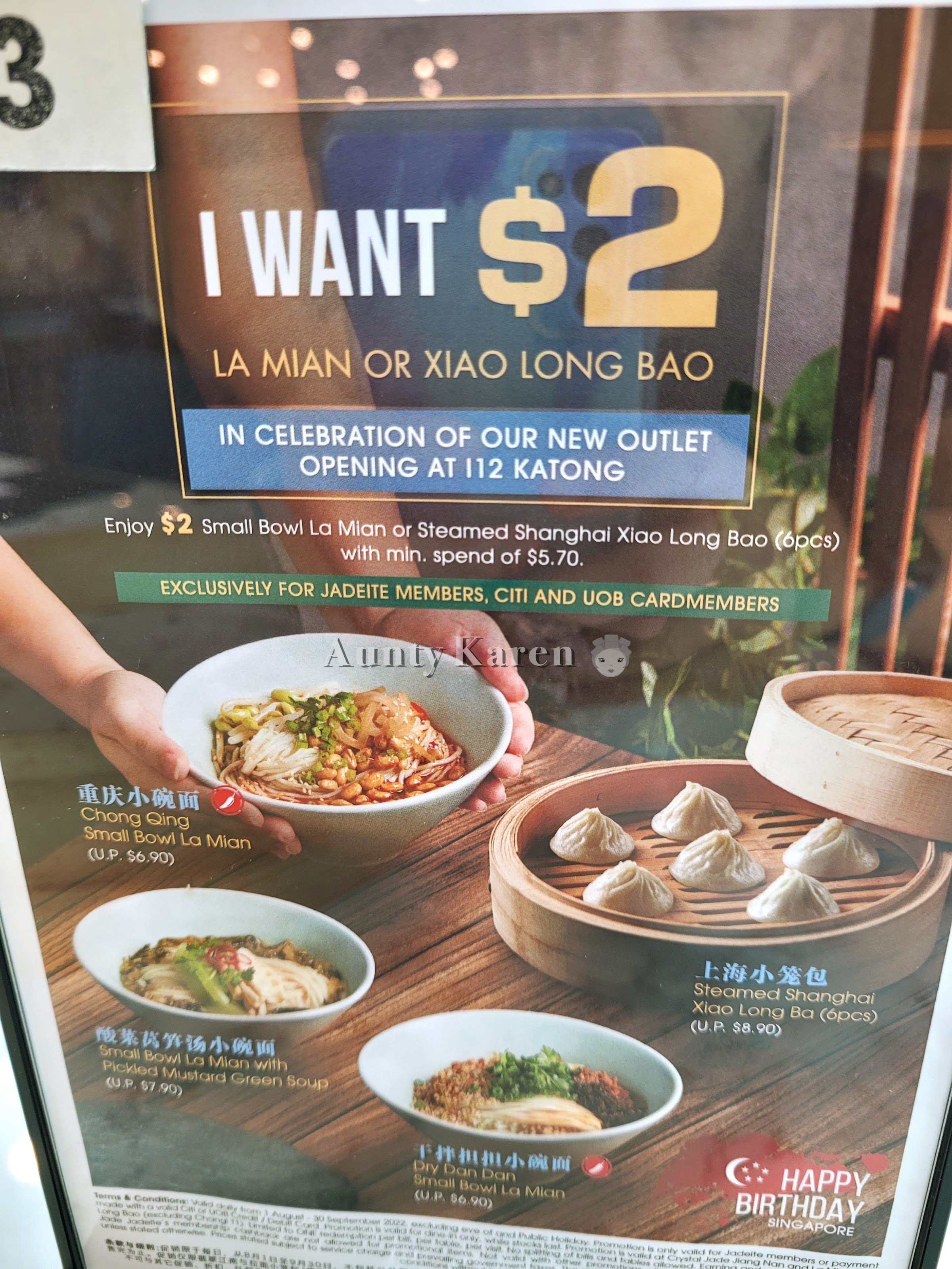 A poster of Crystal Jade's $2 promotion showing bowls of lamian and a bambooo steamer of Xiao Long Bao