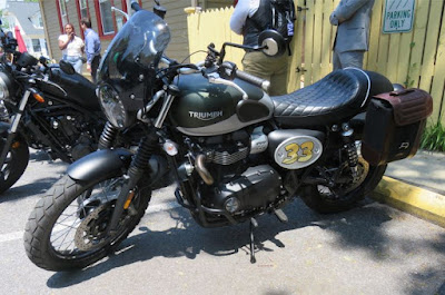 Motorcycle parked next to curb.