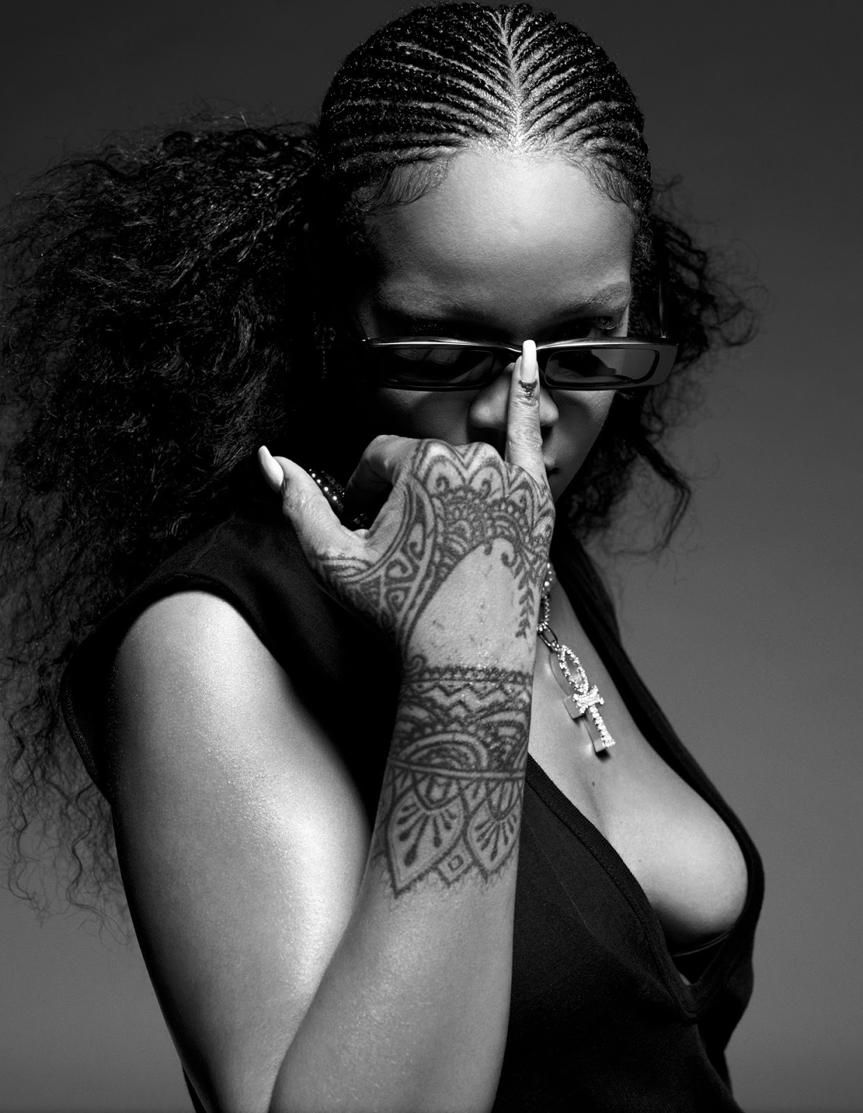 Rihanna sexy cleavage and big breasts in fashion model photo