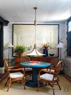 Beata Heuman card table in basement with low hanging mid-century rattan and fabric pendant light